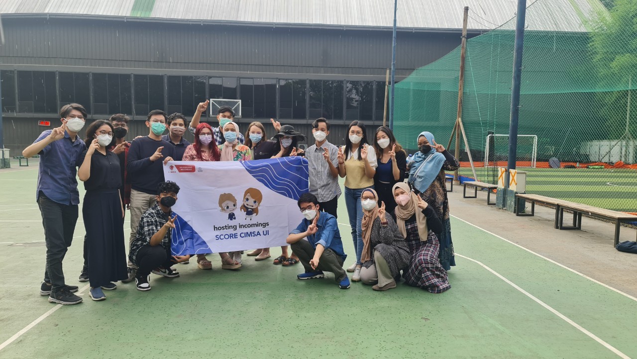 A group of people holding a banner

Description automatically generated with medium confidence